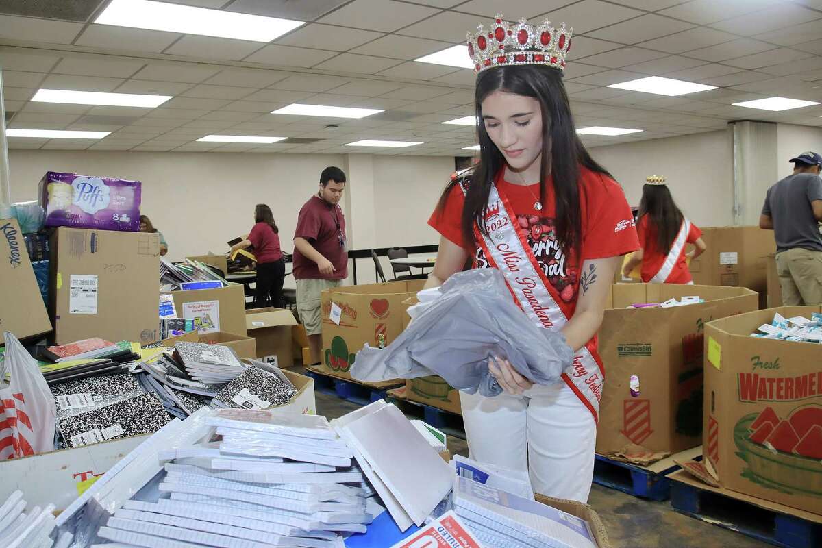 Jessica Cruz, a Pasadena Strawberry Festival 2022 title winner, sorts donated school supplies obtained through the Pasadena community’s Fill the Bus drive on Aug. 1.