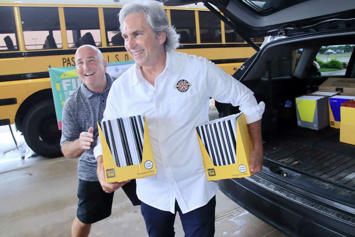 Pasadena Mayor Jeff A. Wagner and Pasadena ISD Associate Superintendent Troy McCarley unload school supply donations at the Pasadena Convention Center.