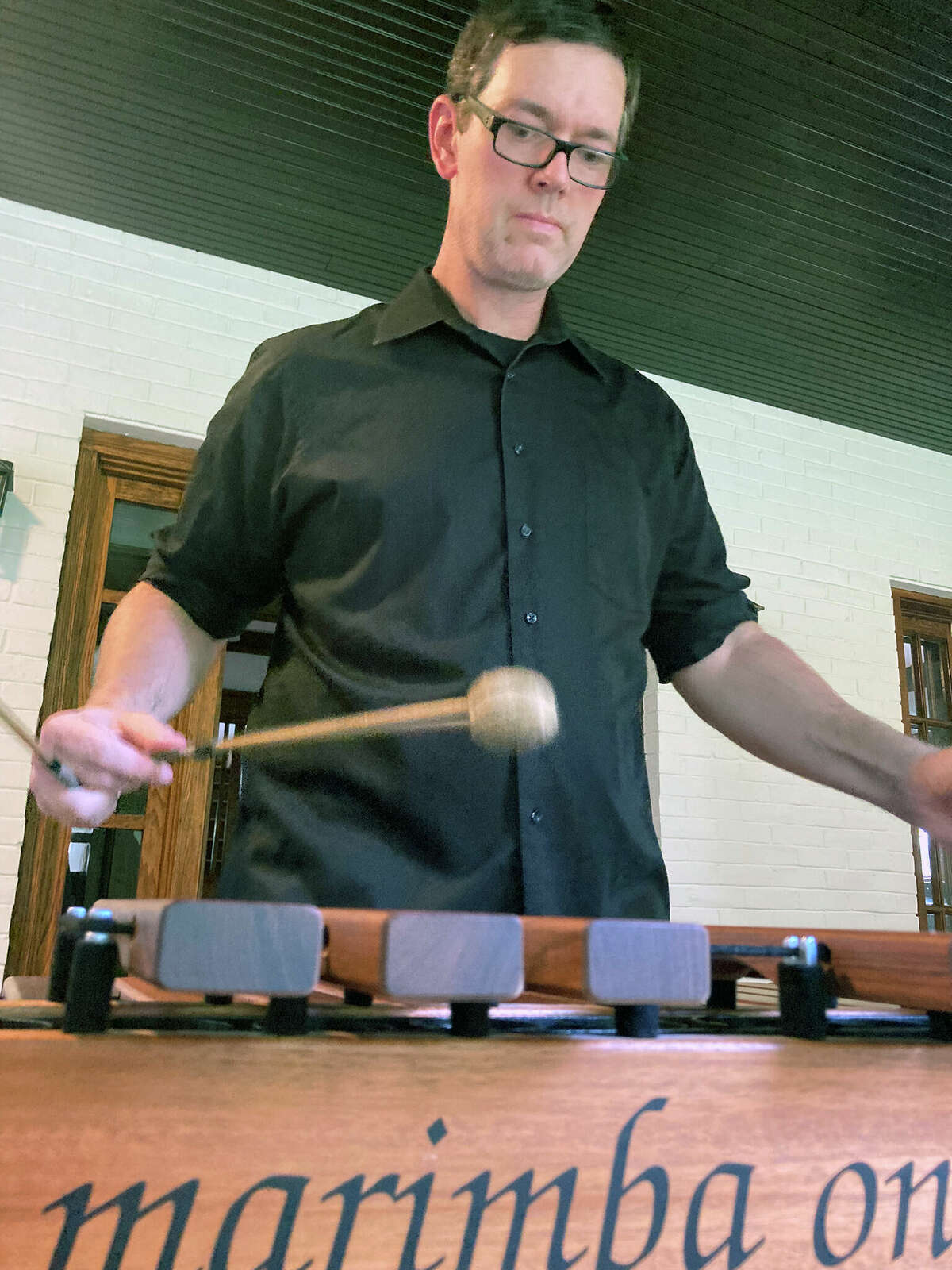 Tyler Carpenter rehearses on his marimbas. The drumline director and percussion instructor at Illinois College will kick of Jacksonville Public Library's latest Music Under the Dome series on Sunday.