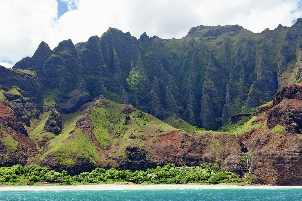 Kalalau Beach on the Napali Coast of Kauai. It can be reached by hiking the 11-mile Kalalau Trail.