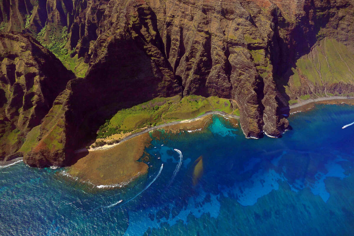 Nualolo Kai from the air on the Napali Coast of Kauai. The Hawaiians who lived here would traverse the cliffs to reach Nualolo Aina, the small valley on the top left.