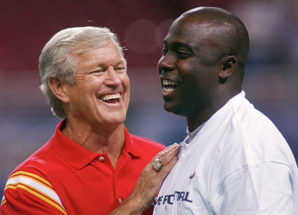 FILE - Kansas City Chiefs coach Dick Vermeil, left, talks with St. Louis Rams running back Marshall Faulk before a preseason NFL football game in St. Louis, Aug. 28, 2003. Vermeil won a Super Bowl with the St. Louis Rams and later coached the Kansas City Chiefs. But Philly is home and he’s going into the Pro Football Hall of Fame as an Eagle. (AP Photo/L.G. Patterson, File)