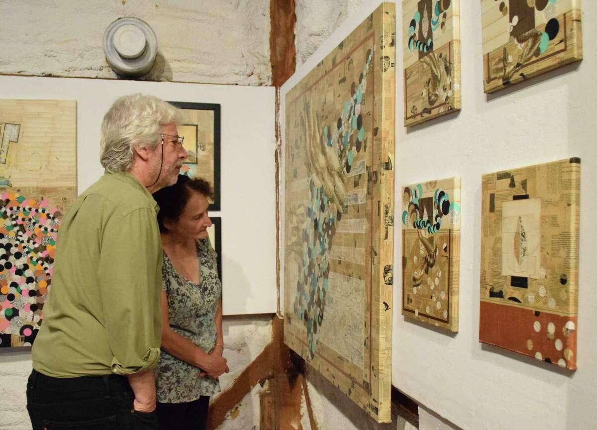 The Silo at Hunt Hill Farm recently hosted a special event in preparation for the upcoming “Fifty Years of the Silo” celebration. Barry Diament and Mary Antonelli of New Milford peruse the paintings by Guilherme Lepca of Brazil, The Silo’s first artist-in-residence.