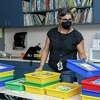 First-grade teacher Carla Aiello organizes books in her classroom as she prepares for the first day of school at Lincoln Elementary School on Friday, August 5, 2022, in Oakland, Calif.