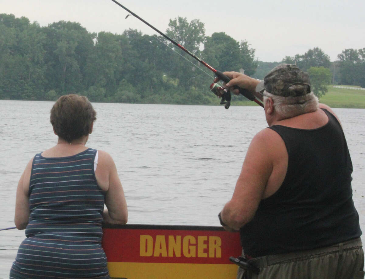 Fishing from the docks at area lakes continues to be popular for anglers.