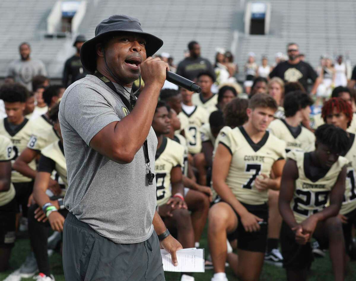 Conroe head coach Cedric Hardeman talks about his team during Meet the Tigers at Buddy Moorhead Stadium, Friday, Aug. 5, 2022, in Conroe. Community members saw performances by the Conroe High School’s band, Golden Girls, cheerleaders and stayed to watch the football team practice under the lights.