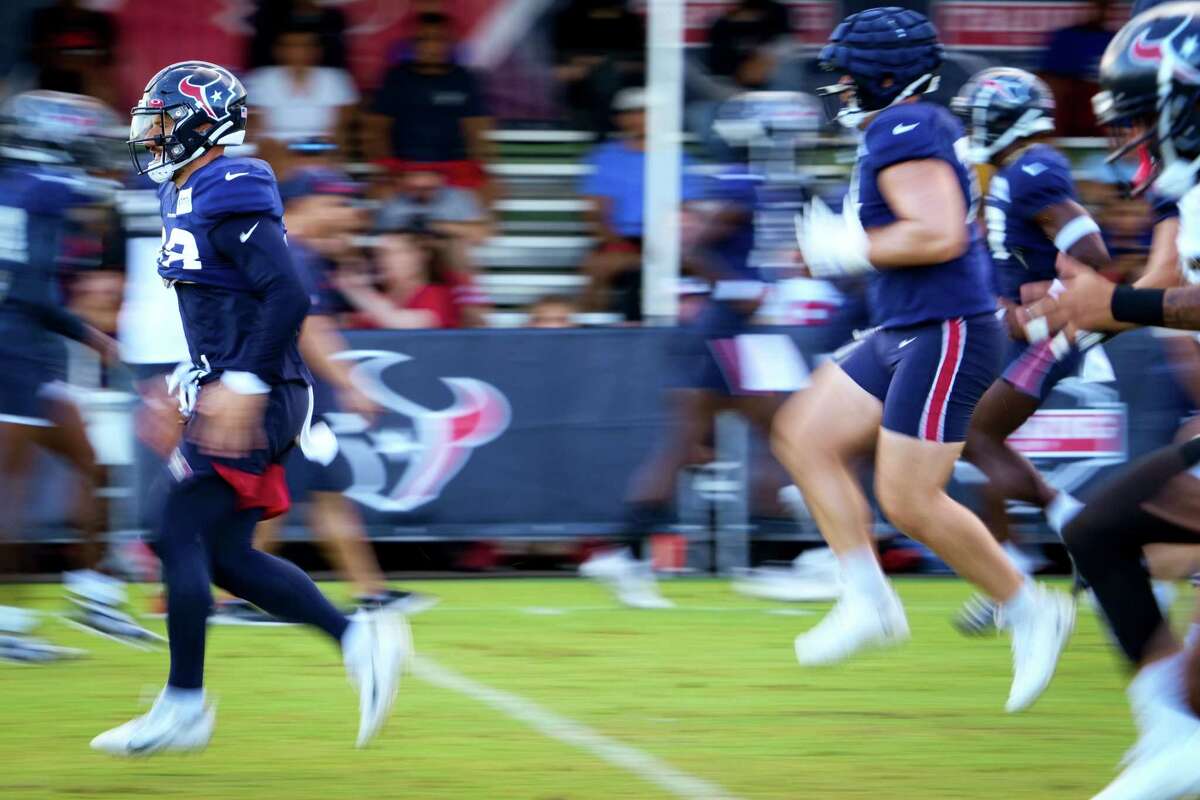 Houston Texans running back Rex Burkhead (28) runs during warm ups at an NFL training camp Saturday, Aug. 6, 2022, in Houston.