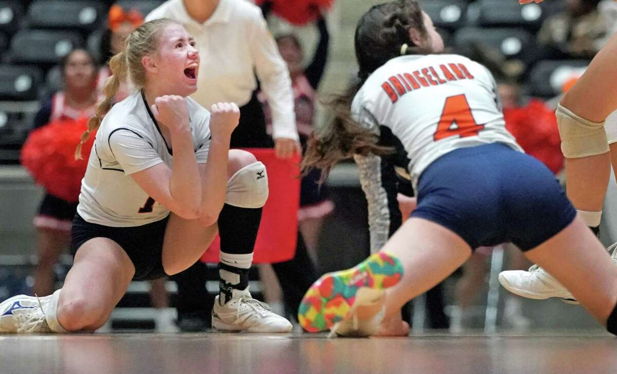 Emma Halstead of Northside Brandeis High School scores a point as Alice Volpe of Bridgeland High School looks on in their volleyball semifinal match against Garland, Texas on Friday, Nov. 19, 2021. Brandeis won.  CREDIT: Louis DeLuca for The Houston Chronicle