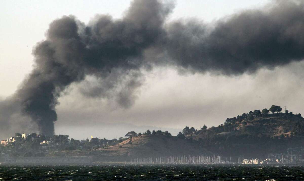 Smoke from a Chevron oil refinery fire fills the sky above Richmond in 2012.