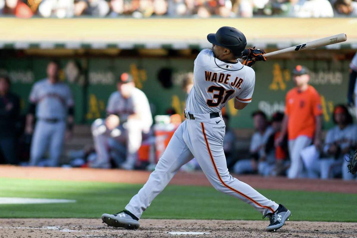 OAKLAND, CA - AUGUST 06: LaMonte Wade Jr. #31 of the San Francisco Giants hits a home run in the sixth inning against the Oakland Athletics at RingCentral Coliseum on August 6, 2022 in Oakland, California. (Photo by Brandon Vallance/Getty Images)