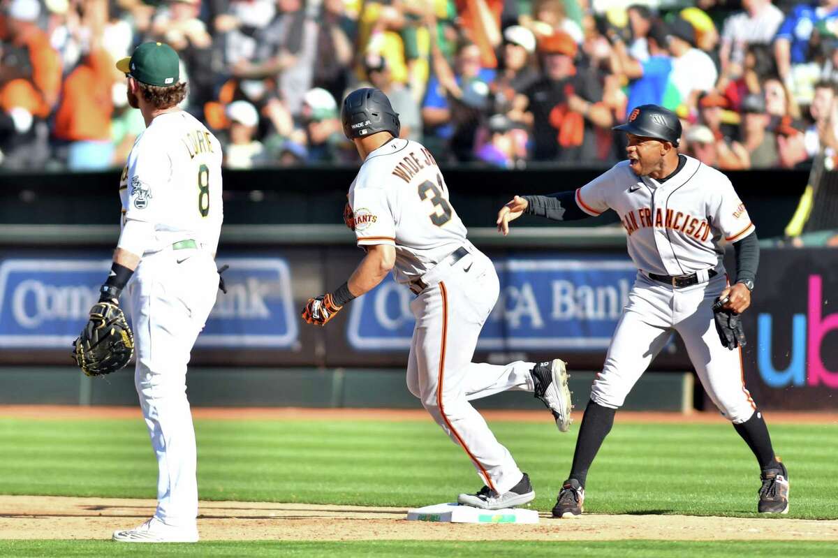 LaMonte Wade Jr. #31 of the San Francisco Giants warms up before