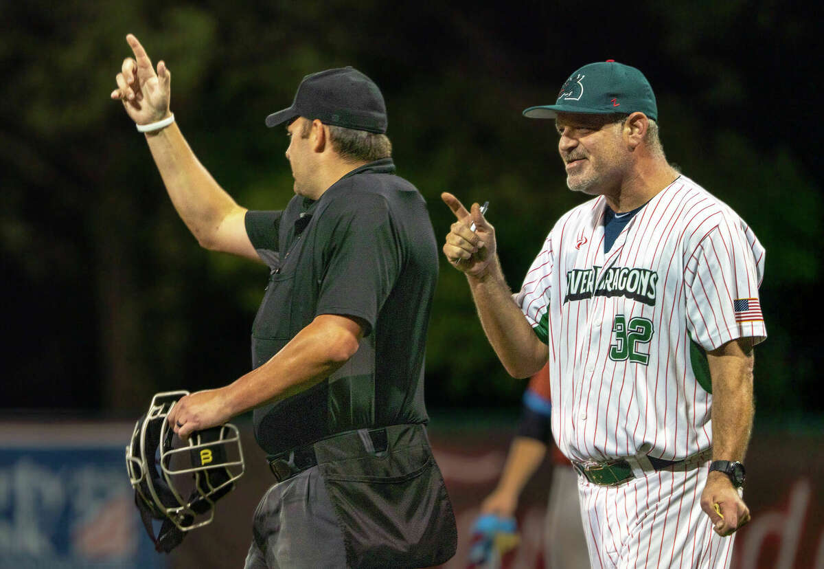 Alton River Dragons manager Darrell Handelsman gets ejected from the game by home plate umpire Aaron Ashlock Saturday at Lloyd Hopkins Field after arguing a play in which a Springfield Lucky Horsehoes ball appeared to be called foul, then reversed, allowing a run a Springfield run to score. 