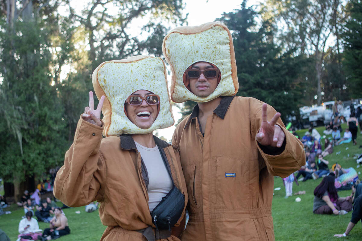 (Left to right) Nani Welchand Evan Davison dress up as 'just toast" at Outside Lands in Golden Gate Park in San Francisco, Calif. on Aug. 6, 2022.