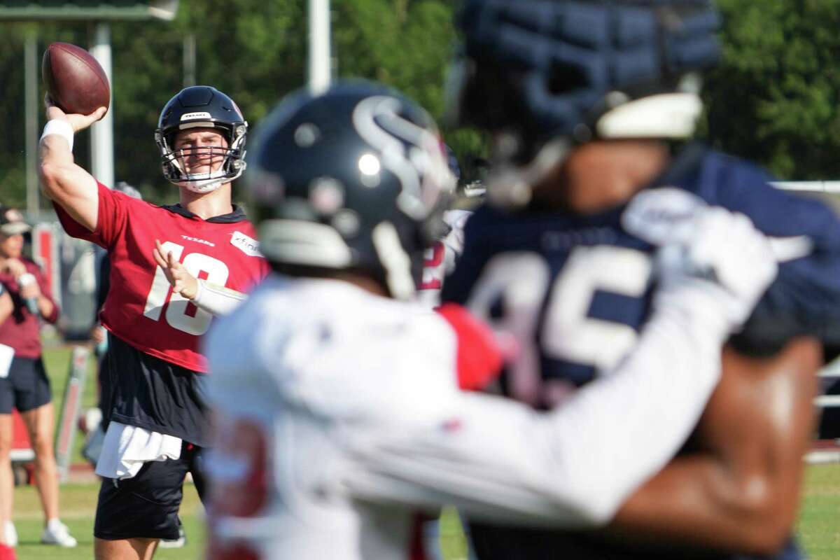 Houston Texans quarterback Davis Mills (10) throws a pass to tight end Pharaoh Brown (85) during an NFL training camp Sunday, Aug. 7, 2022, in Houston.