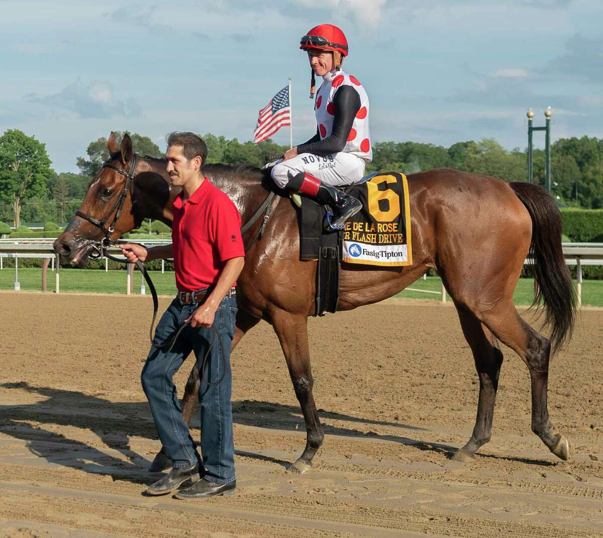 Our Flash Drive with jockey Dylan Davis on board is lead in a circle in front of the grandstand following their victory in the De La Rose stakes at Saratoga Race Course on Sunday, Aug. 7, 2022, in Saratoga Springs, N.Y. (Jenn March, Special to the Times Union)