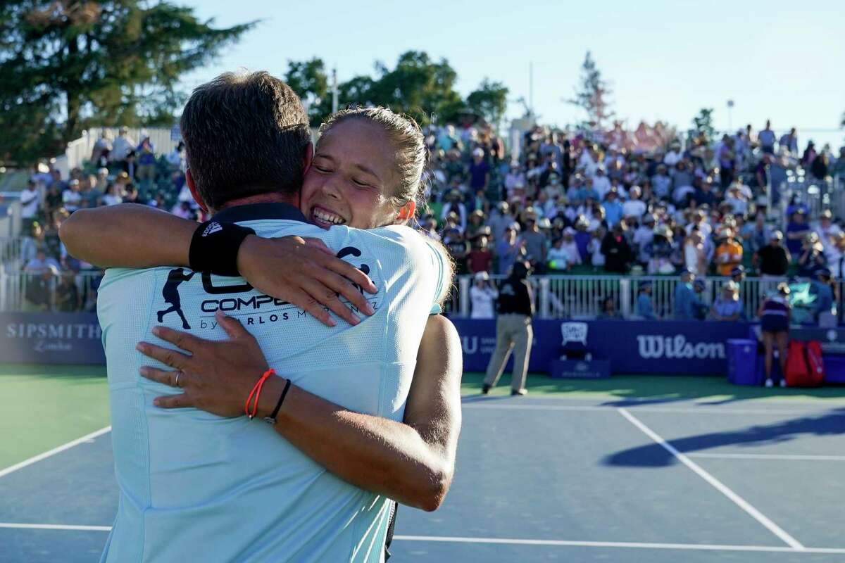 Daria Kasatkina, of Russia, hugs her coach, Carlos Martinez, after winning the Mubadala Silicon Valley Classic tennis tournament, defeating Shelby Rogers, of the United States, 6-7 (2), 6-1, 6-2 in San Jose, Calif., Sunday, Aug. 7, 2022. (AP Photo/Godofredo A. Vásquez)