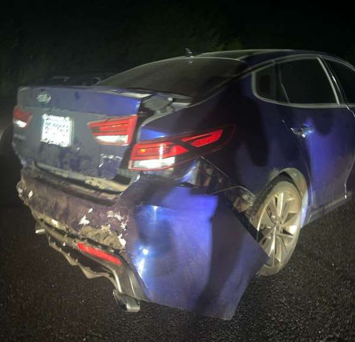 This photo shows the damage to the 2016 Kia Optima SXL that police say was rear-ended by a state police sergeant last month in Brookfield. The car was totaled, the driver’s lawyer says.