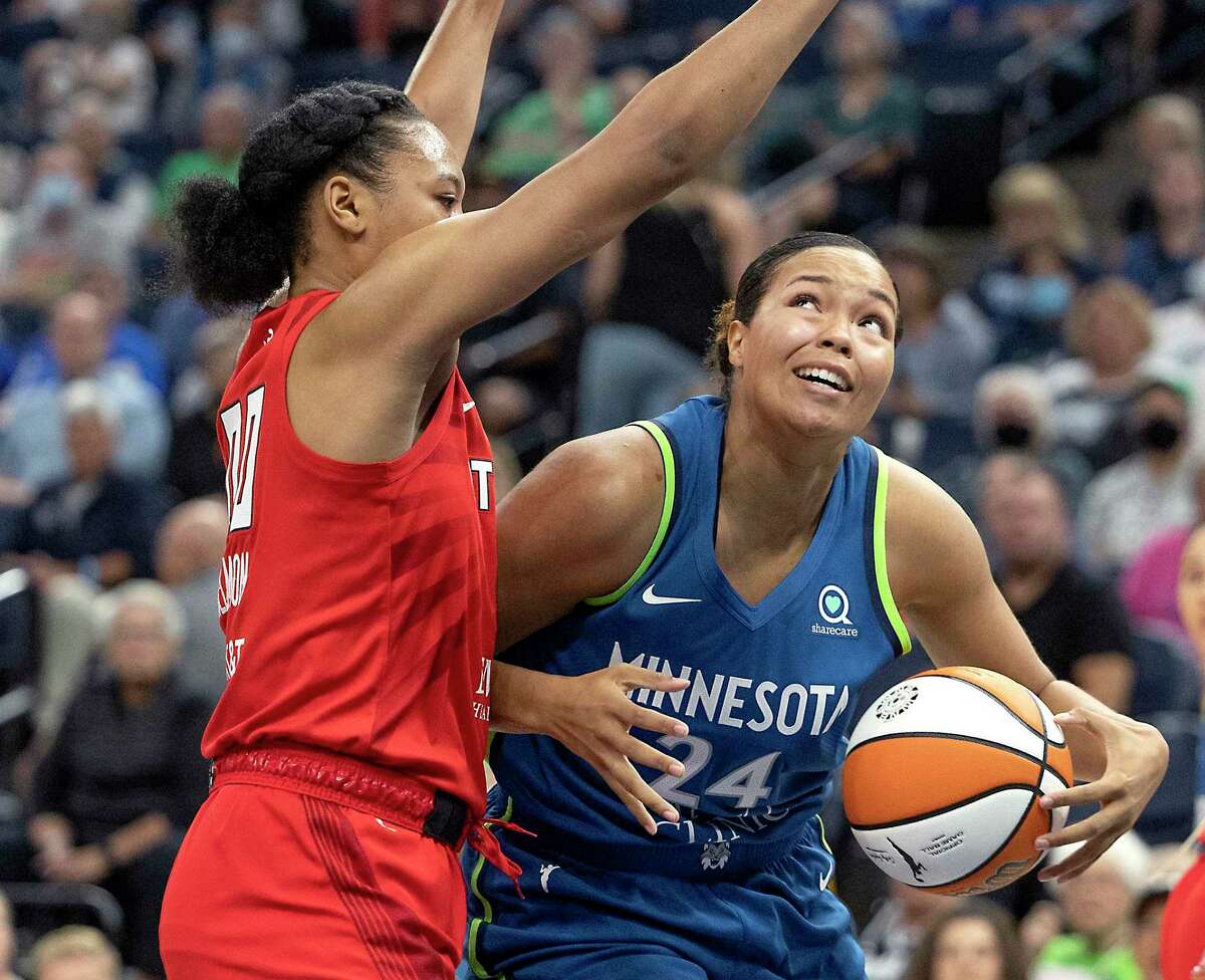 Minnesota Lynx forward Napheesa Collier, right, and Atlanta Dream forward Naz Hillmon battle under the net during Sunday’s game. Collier played 21 minutes in her first game after giving birth to her daughter, Mila.