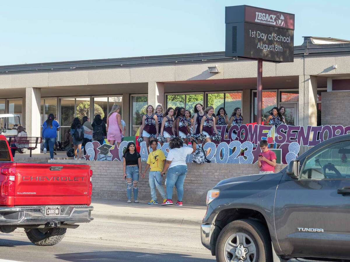 Legacy cheerleaders welcome students as they arrive 08/08/2022 outside Legacy High School for the first day of school for the 2022-2023 year.  Reporter-Telegram file photo