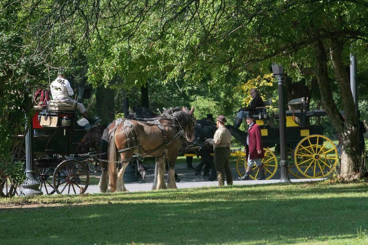 Horse drawn carriages are seen during the filming of the HBO series ‘The Gilded Age' in Washington Park on Monday, Aug. 8, 2022 in Albany, N.Y.
