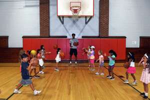 UConn men’s basketball team inspires campers at Southport clinic