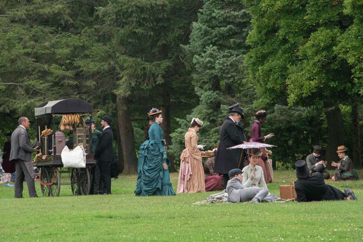 Actors are seen in what locals use as the dog park in Washington Park during the filming of the HBO series ‘The Gilded Age' on Monday, Aug. 8, 2022 in Albany, N.Y.