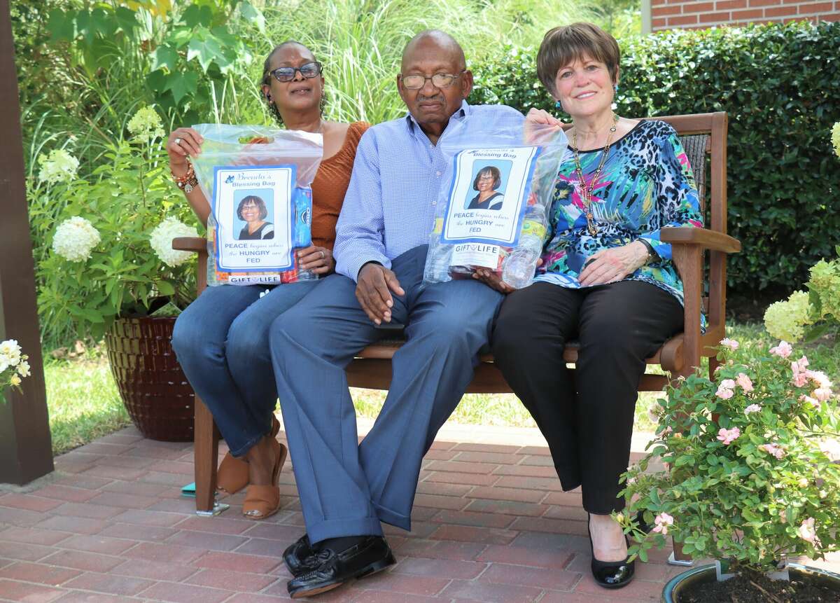 Lisa Zachary (sister of Brenda Roberts), Joe Gregory (friend of Brenda Roberts) and Gift of Life founder Regina Rogers sit on the bench that was built in Brenda's memory on Monday, Aug. 8, 2022