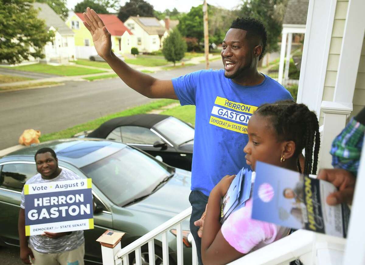 Herron Gaston campaigns door-to-door for the 23rd district senate primary on Judson Street in Bridgeport, Conn. on Friday, August 5, 2022.