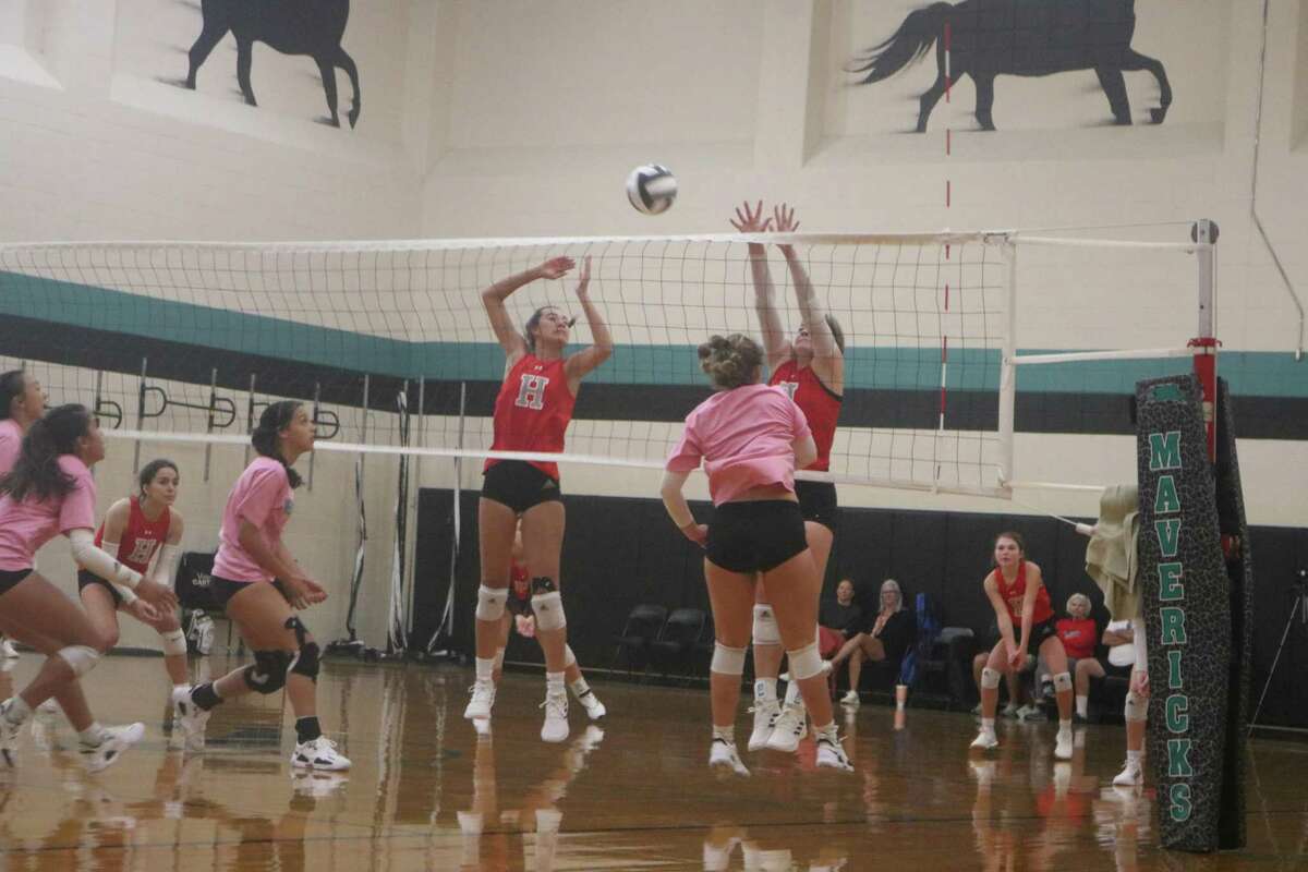 A  Pasadena Memorial outside hitter attempts to score a point in Friday's scrimmage with Huffman High School.