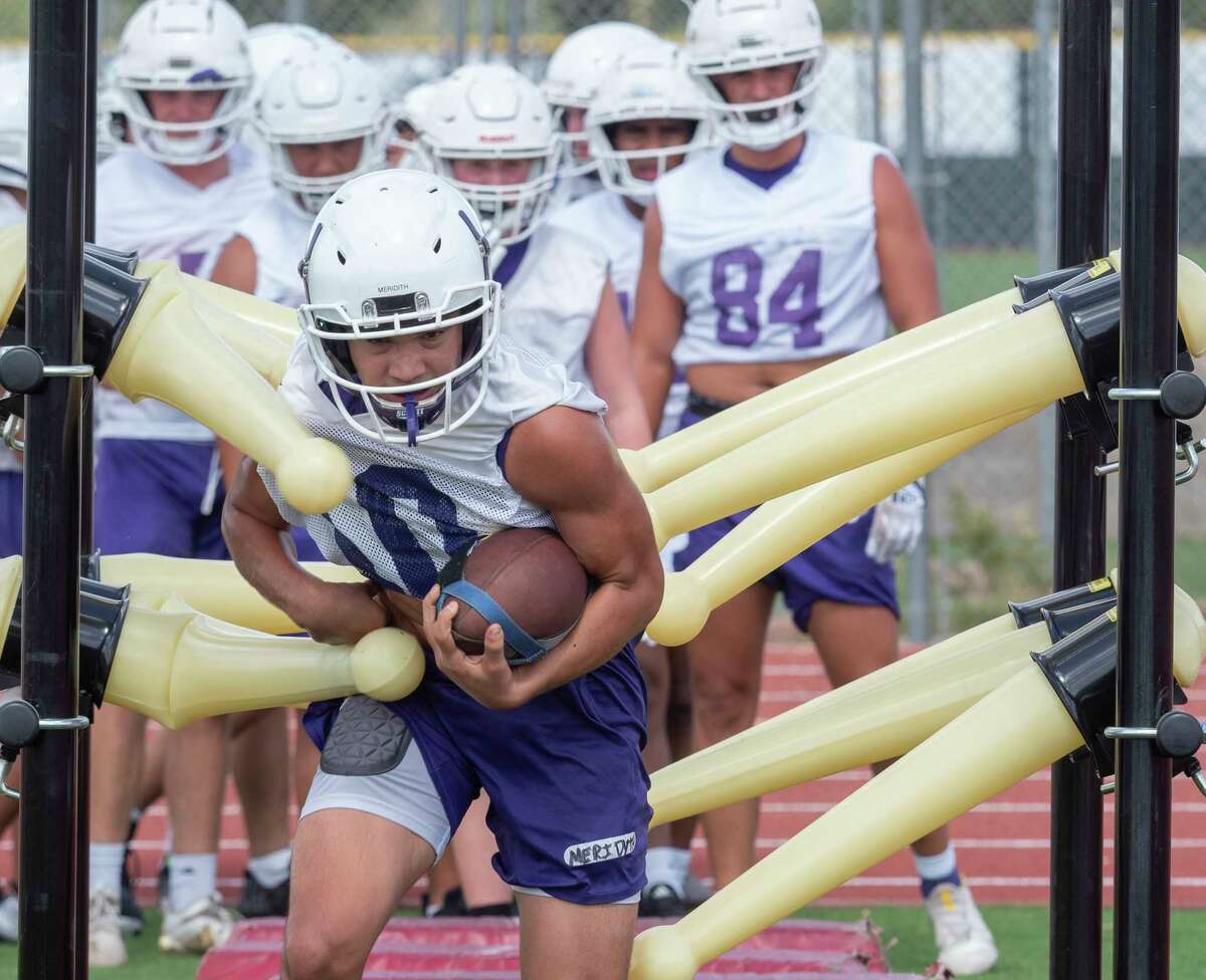 Scenes from Midland High's first day of football practice
