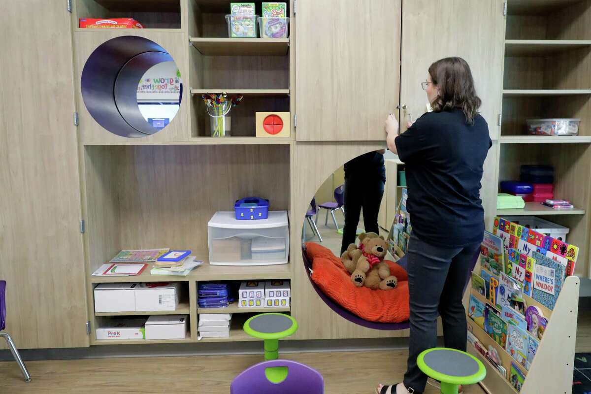 Educational aide Ava Semler gets things ready in Melodie Sharpen’s classroom at the new Roark Early Education Center Monday, Aug. 8, 2022 in Willis, TX. The school is for pre-K students and is set to begin classes this week.