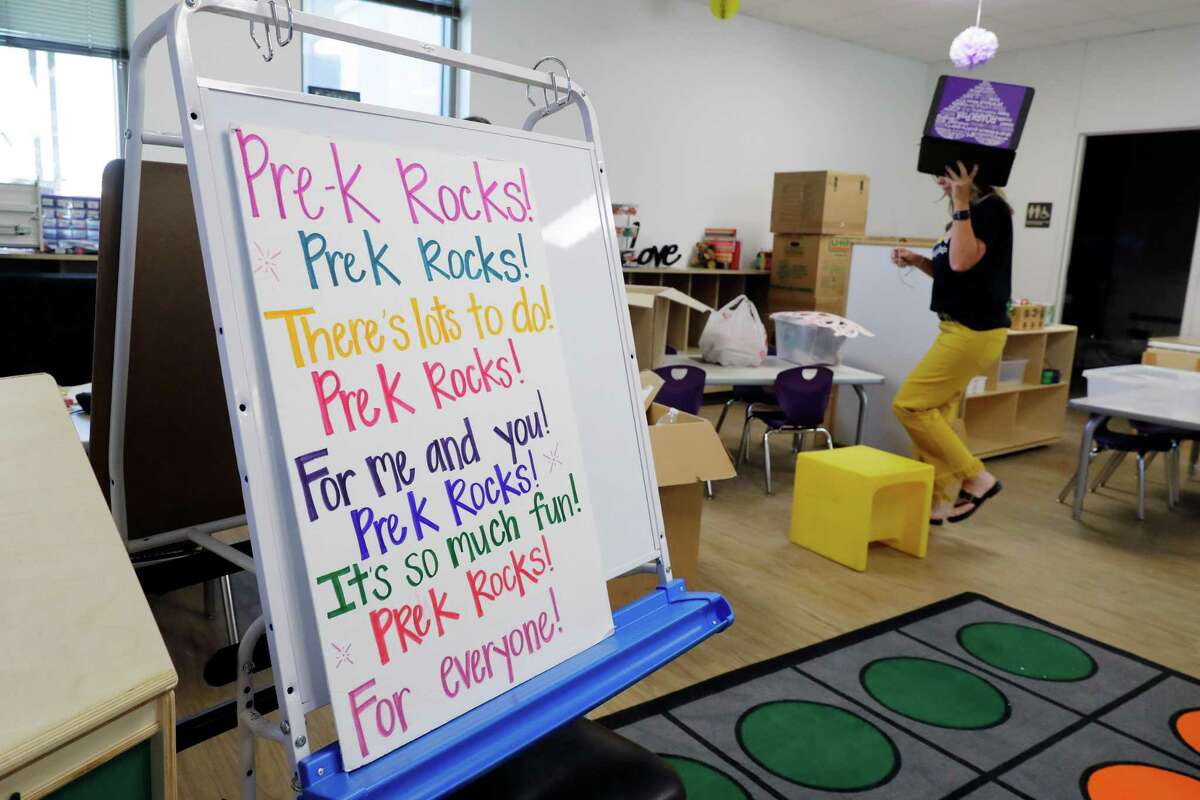 Teacher Melodie Sharpen scrambls as she gets her classroom ready for students at the new Roark Early Education Center Monday, Aug. 8, 2022 in Willis, TX. The school is for pre-K students and is set to begin classes this week.