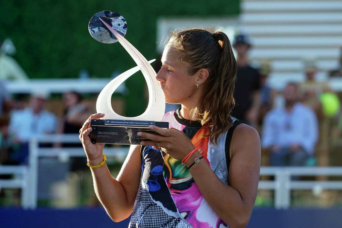 Daria Kasatkina, of Russia, kisses the Mubadala Silicon Valley Classic trophy after her 6-7 (2), 6-1, 6-2 victory against Shelby Rogers, of the United States, in San Jose, Calif., Sunday, Aug. 7, 2022. (AP Photo/Godofredo A. Vásquez)