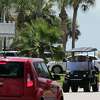 A golf cart drives in the Pirates Beach subdivision Saturday, Aug. 9, 2014, in Galveston.