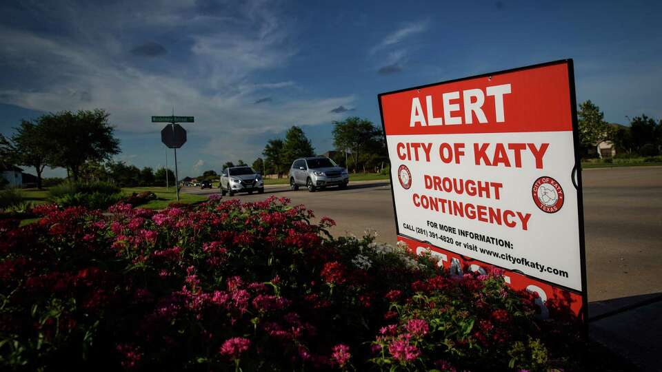 A sign alerts residents to water restrictions and drought information Monday, Aug. 8, 2022, in Katy.