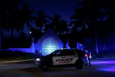 Police stand outside an entrance to former President Donald Trump's Mar-a-Lago estate, Monday, Aug. 8, 2022, in Palm Beach, Fla. Trump said in a lengthy statement that the FBI was conducting a search of his Mar-a-Lago estate and asserted that agents had broken open a safe.