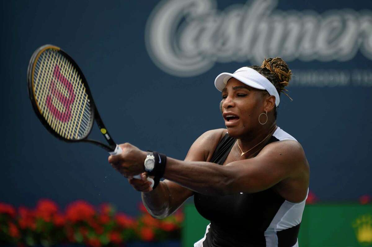Serena Williams, of the United States, returns the ball during a match against Nuria Parrizas-Diaz, of Spain, during the National Bank Open tennis tournament in Toronto, Monday, Aug. 8, 2022. (Christopher Katsarov/The Canadian Press via AP)
