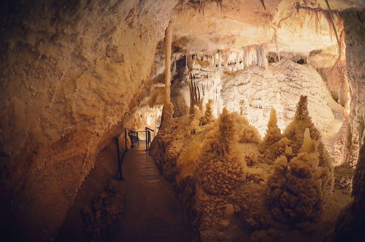 A staircase and path leading downward into Sonora Caverns in Texas.