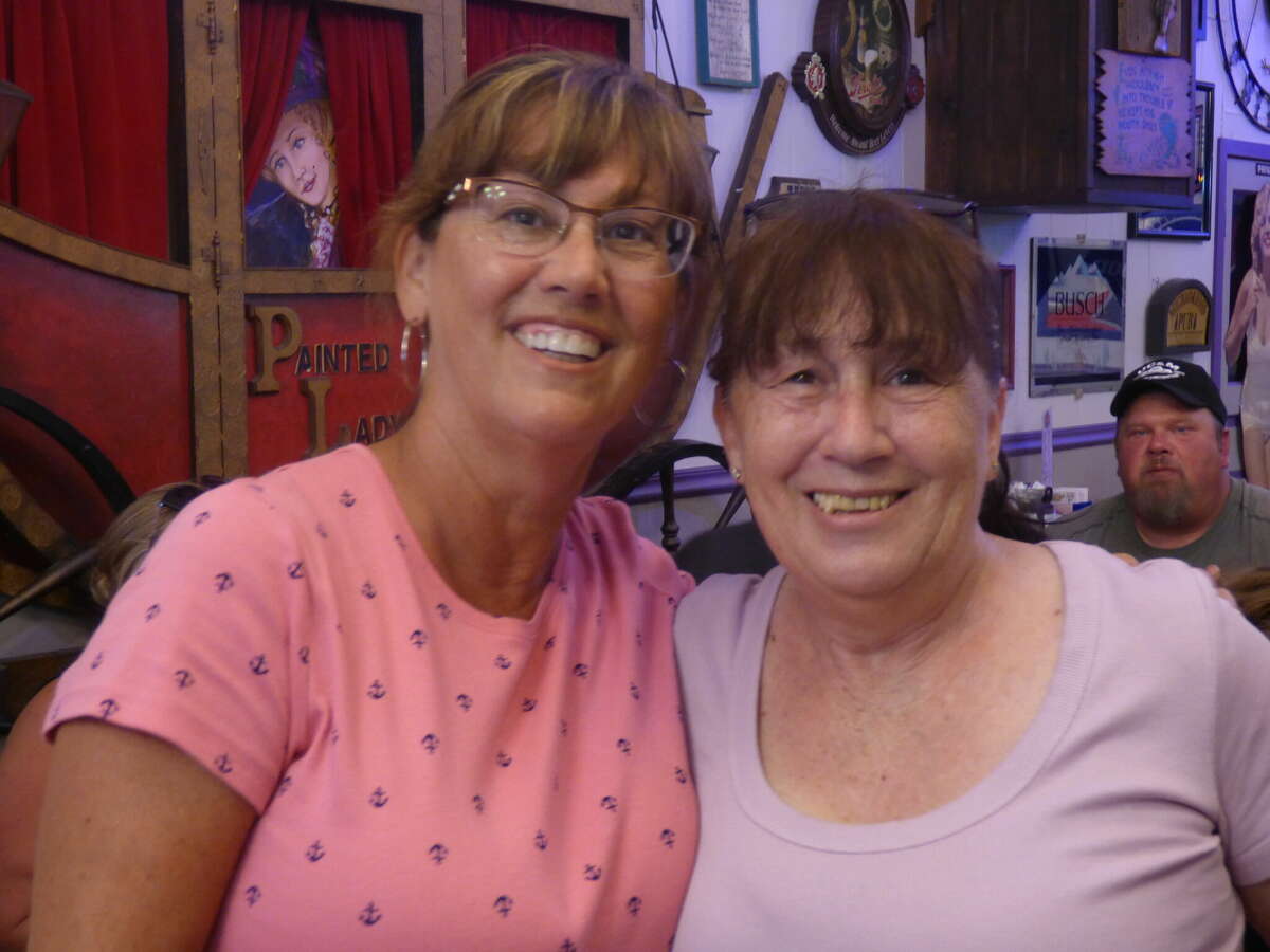 Kimberly DeMars (left) enjoys lunch at the Painted Lady Saloon with longtime pen pal Holly Franchina, of Australia. The pair recently met for the first time after over 50 years of writing letters. 