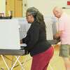 Middletown voters cast their ballots Tuesday morning during Connecticut’s primary election at Snow Elementary School on Wadsworth Street. According to a moderator’s tally, 50 of the district’s 1,078 eligible Democratic voters had turned out by 11:30 a.m.