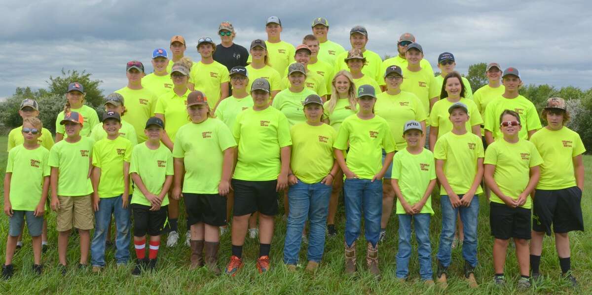 The Carlinville Clay Busters team poses after the shooting season wound up at the Academics, Integrity, Marksmanship Grand National Championships in Sparta, Illinois, where three teams of shooters won national championships in August.