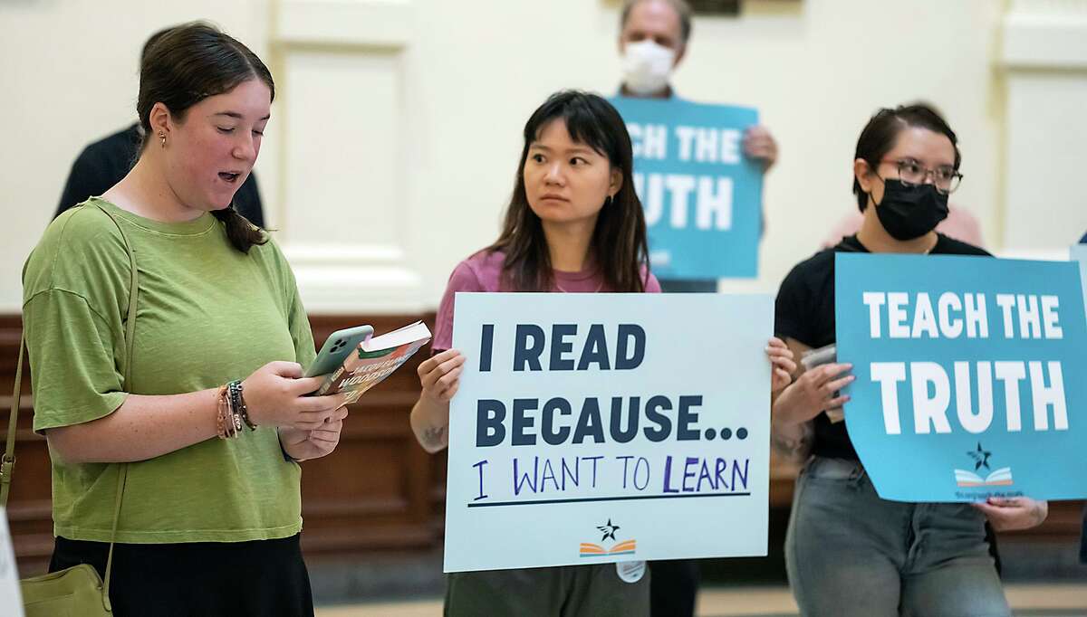 Shayna Levy, left, an Austin ISD high school student, speaks during the Texas Freedom Network read-in demonstration held on Tuesday, July 26, 2022, in Austin, Texas. Attendees read from some of the books being targeted for banning during a Texas Freedom Network’s Teach the Truth Coalition read-in demonstration held at the Texas State Capitol Rotunda.