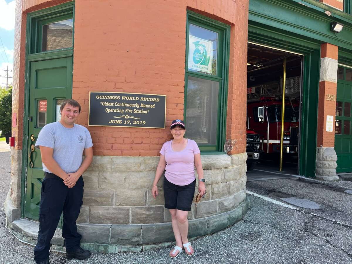 Holly Franchina, a volunteer fire lieutenant with the country fire authority in Victoria, visits local firefighters at the Manistee Fire Hall.