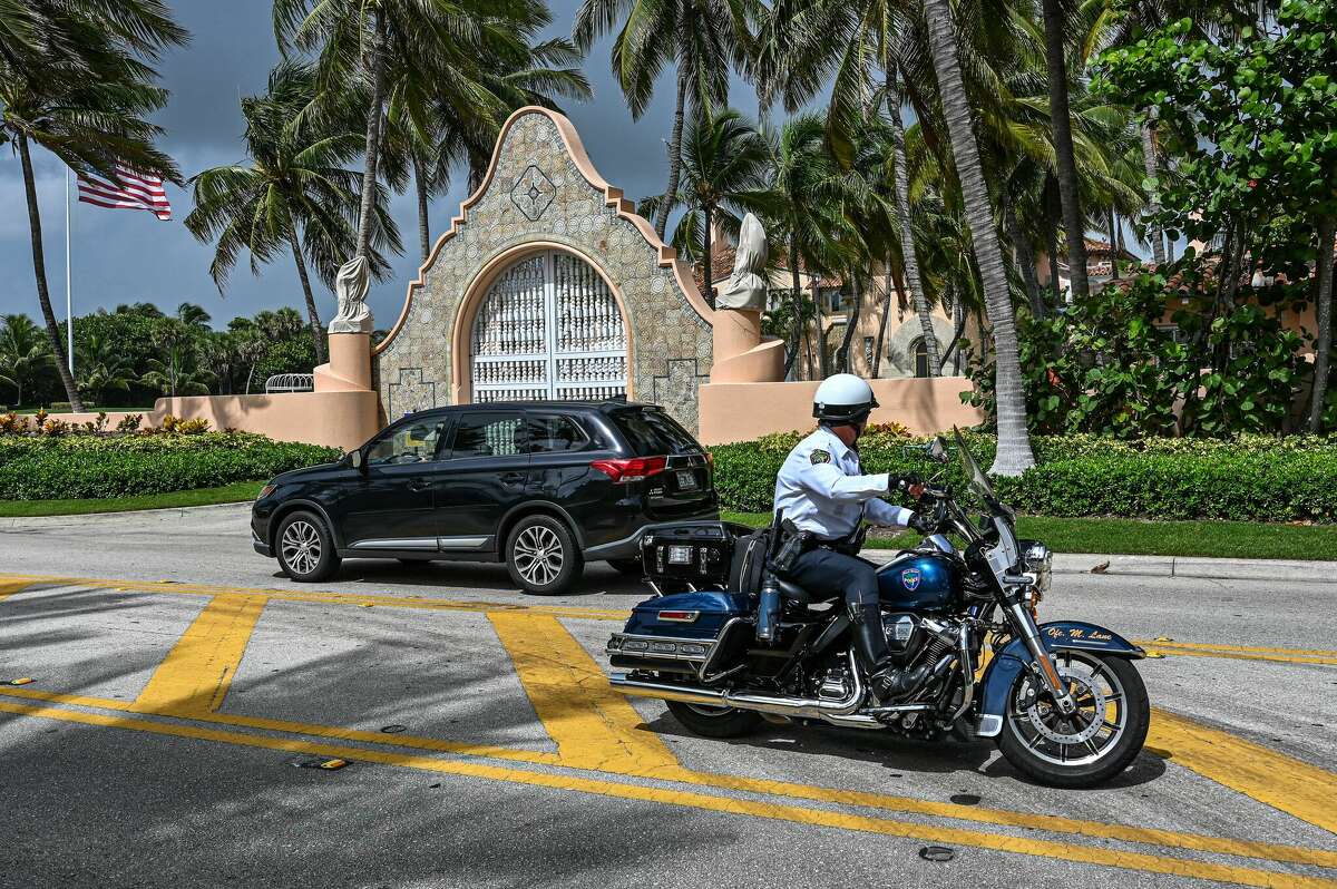 Local law enforcement officers are seen in front of the home of former President Donald Trump at Mar-A-Lago in Palm Beach, Florida on August 9, 2022. - Former US president Donald Trump said August 8, 2022 that his Mar-A-Lago residence in Florida was being "raided" by FBI agents in what he called an act of "prosecutorial misconduct." (Photo by Giorgio Viera / AFP) (Photo by GIORGIO VIERA/AFP via Getty Images)
