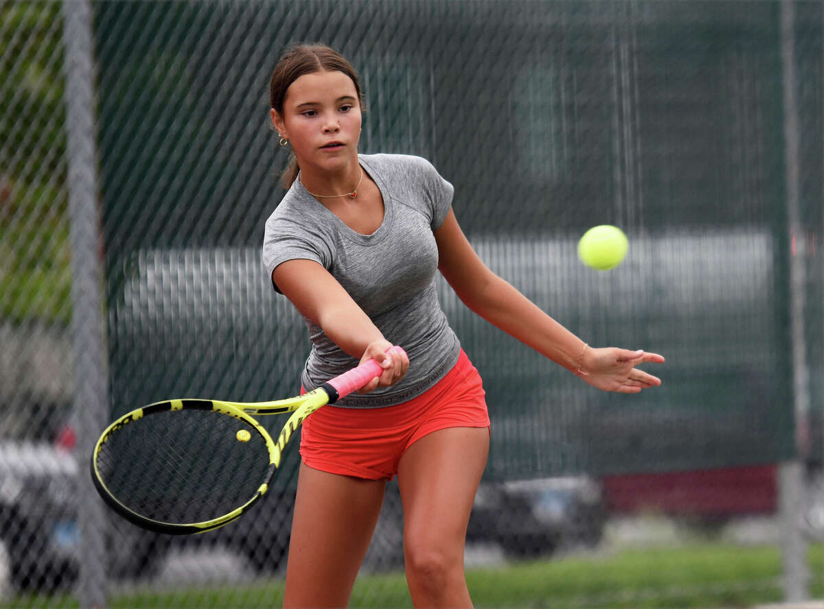 Edwardsville High School freshman Katie Woods hits a forehand shot during practice on Tuesday inside the EHS Tennis Center. The Edwardsville girls tennis team started practicing on Monday. 