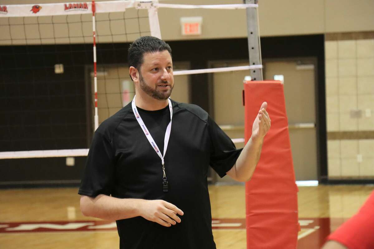 First-year Lamar volleyball coach Brandon Crisp speaks to his players during the first day of practice on Tuesday, Aug. 9, 2022, at McDonald Gym.