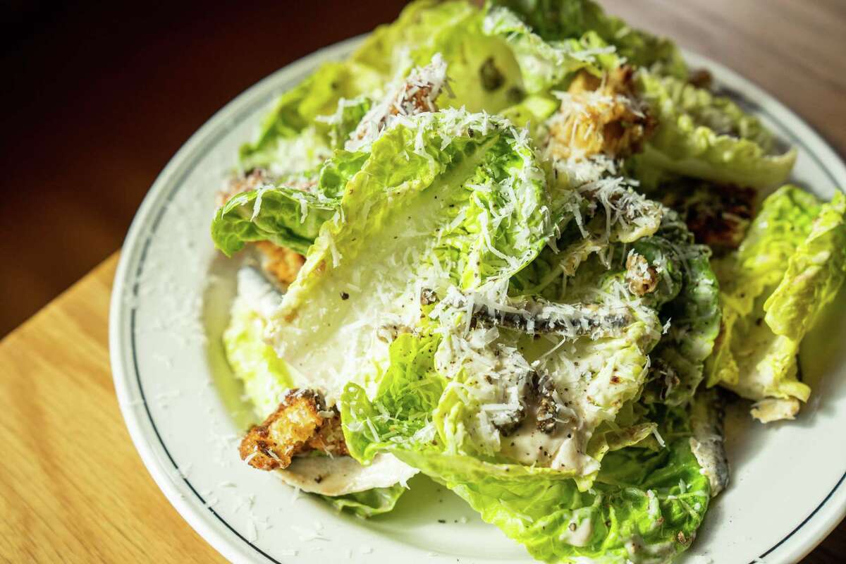 Ostia's popular Caesar is a composition of romaine, shaved pecorino and croutons in an anchovy dressing.