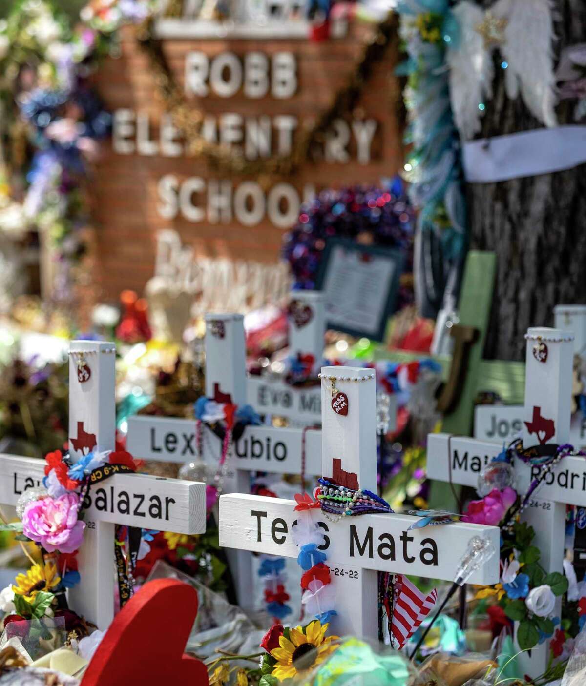 Tess Marie Mata’s cross at Robb Elementary School’s makeshift memorial site is seen Monday, June 13, 2022 in Uvalde. Mata one of 19 children and two adults killed May 24, 2022 at Robb Elementary School in Uvalde by a gunman with an AR 15-style assault rifle, was buried Monday.