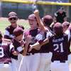 Pearland's starting pitcher Pearland Kaiden Shelton, center, is mobbed by his teammates after their defeated Tulsa at the Southwest Regional Little League baseball championship game in Waco, Texas, Tuesday, Aug. 9, 2022. Time