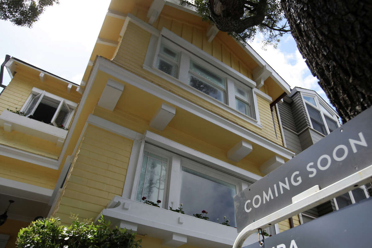 A sign is posted in front of a home Compass listed for sale in San Francisco. 